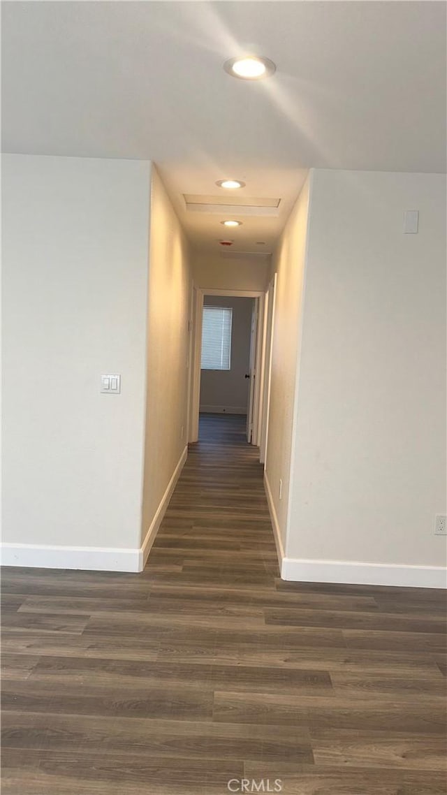 corridor featuring dark hardwood / wood-style floors