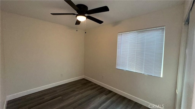 empty room featuring ceiling fan and dark hardwood / wood-style flooring