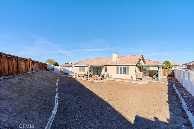 rear view of property with a patio area