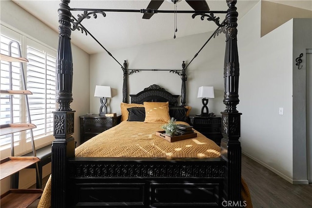 bedroom with dark hardwood / wood-style floors and multiple windows