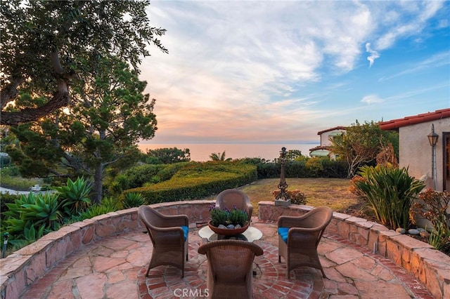 view of patio terrace at dusk