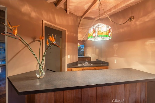 interior space with sink, beam ceiling, and wooden ceiling