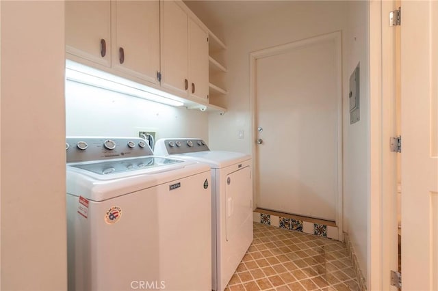 laundry area with cabinets and separate washer and dryer