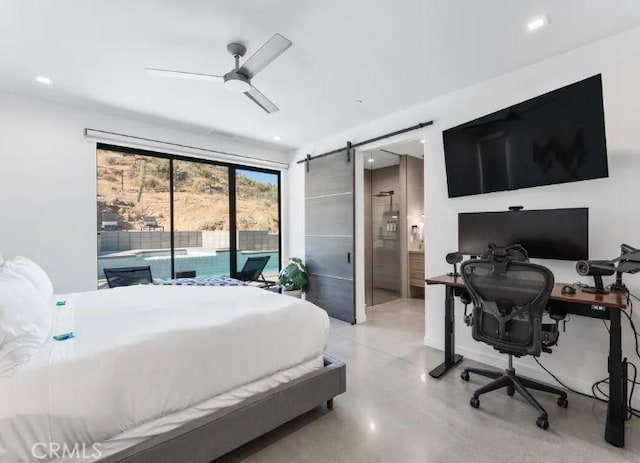 bedroom featuring access to outside, a barn door, ceiling fan, and ensuite bathroom