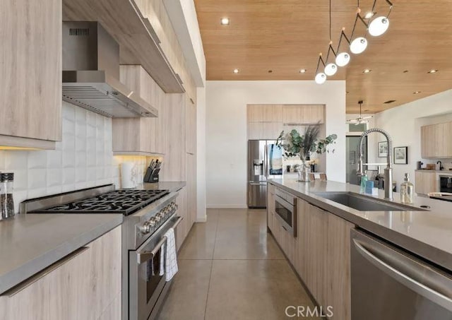 kitchen with sink, stainless steel appliances, wooden ceiling, wall chimney exhaust hood, and light brown cabinets