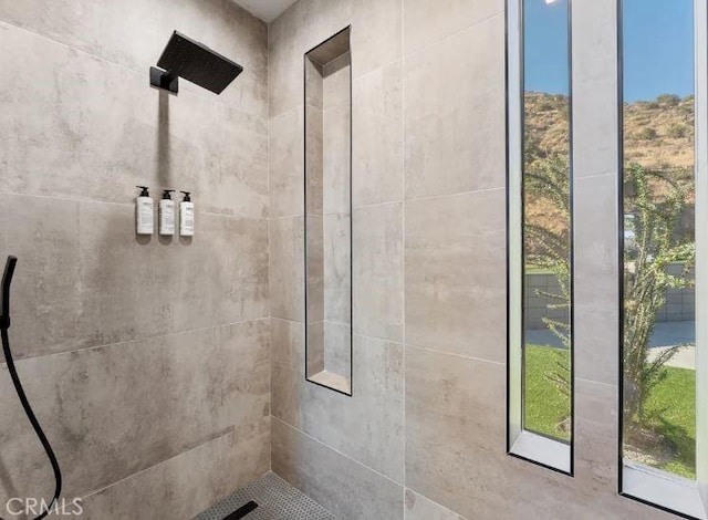 bathroom with tiled shower