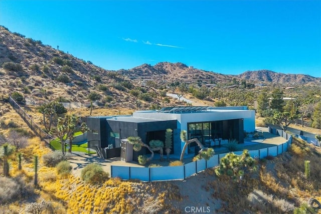 rear view of house with a mountain view