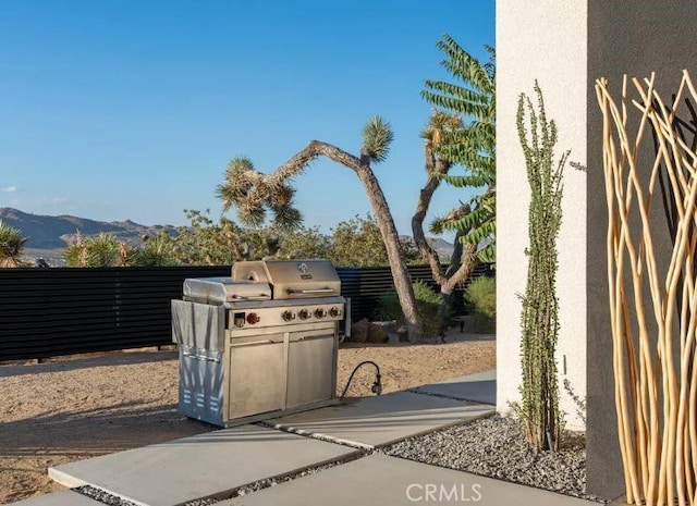 view of patio / terrace featuring a mountain view