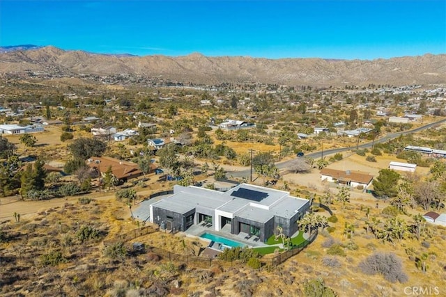 birds eye view of property with a mountain view