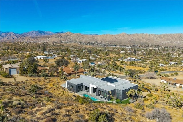 drone / aerial view featuring a mountain view