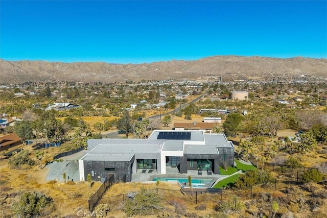 birds eye view of property with a mountain view