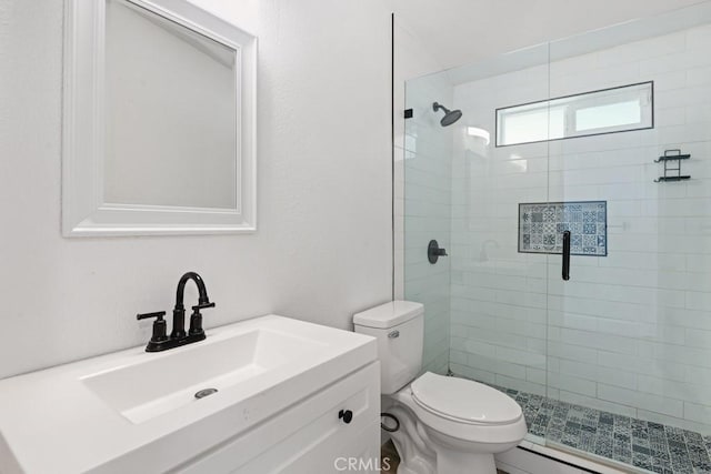 bathroom with a shower with door, vanity, and toilet