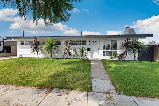 view of front of property with a garage and a front yard