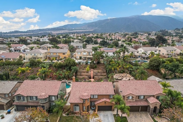 birds eye view of property featuring a mountain view