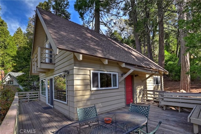 exterior space with a balcony and a deck