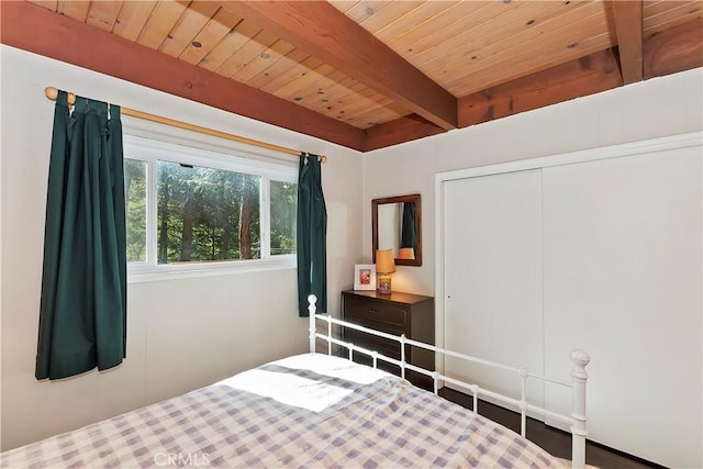 bedroom featuring wood ceiling and beam ceiling