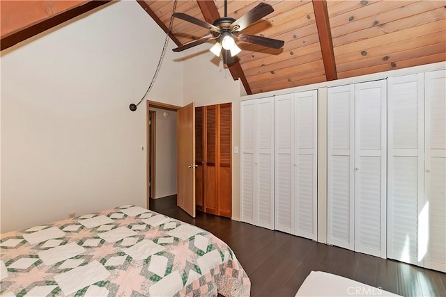 unfurnished bedroom featuring high vaulted ceiling, dark hardwood / wood-style flooring, wood ceiling, ceiling fan, and multiple closets