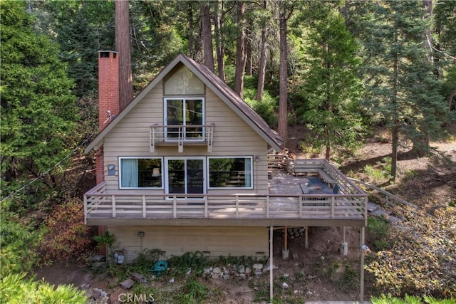 rear view of house with a balcony