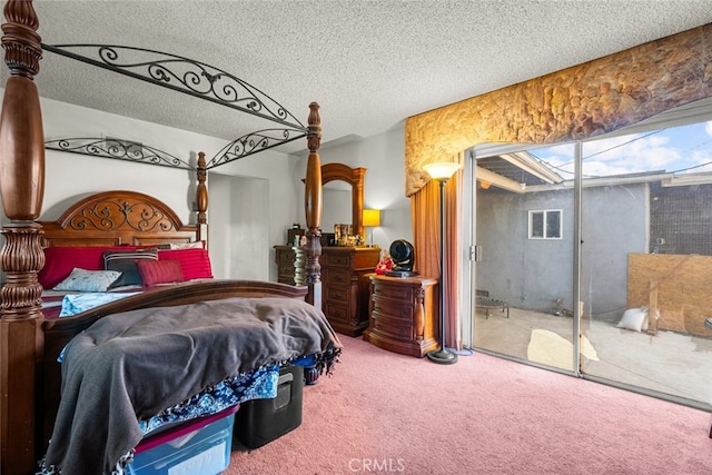 bedroom featuring carpet floors and a textured ceiling