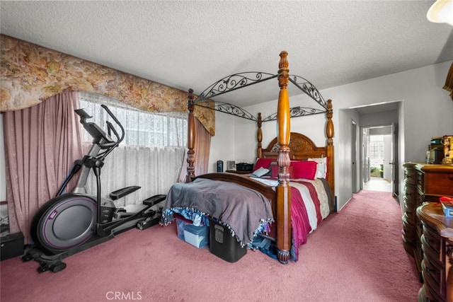 bedroom with carpet and a textured ceiling