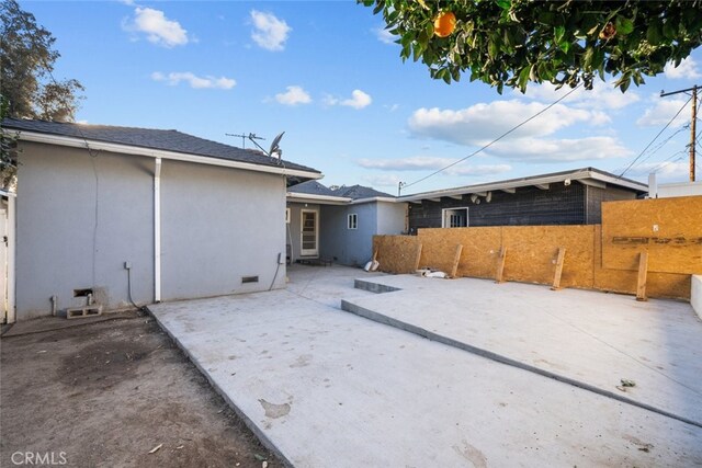 back of property with a patio area