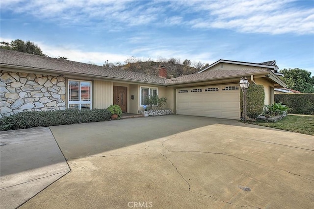 single story home with a garage