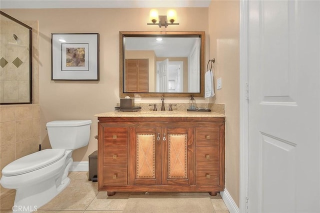 bathroom featuring an enclosed shower, vanity, tile patterned floors, and toilet