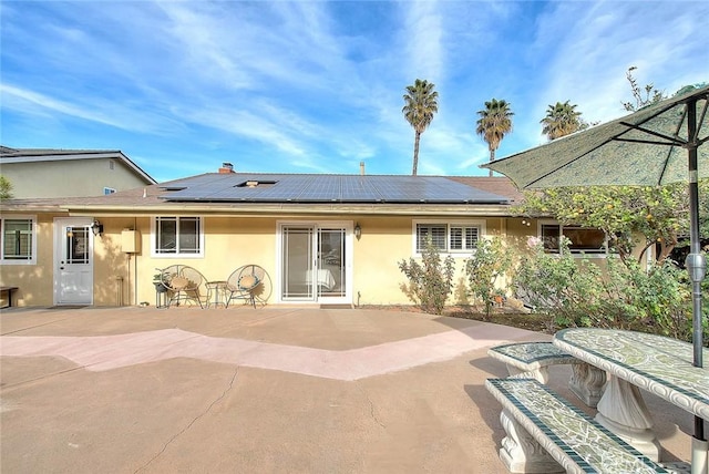 rear view of property with a patio