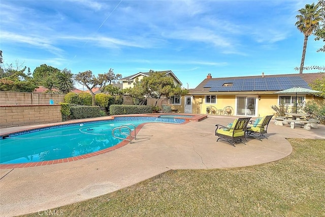 view of swimming pool featuring a yard and a patio