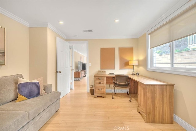 office featuring ornamental molding and light hardwood / wood-style floors