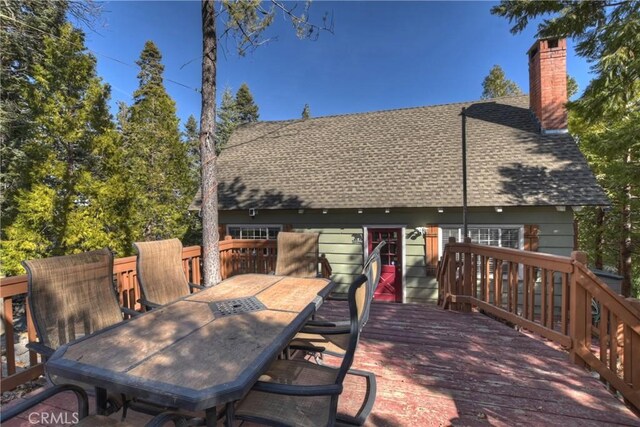 deck featuring outdoor dining area