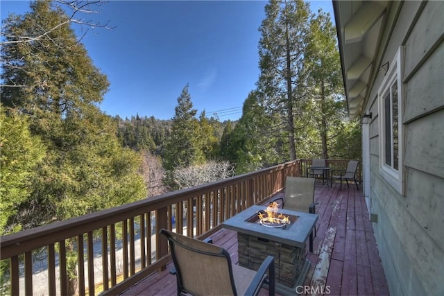 deck with an outdoor fire pit