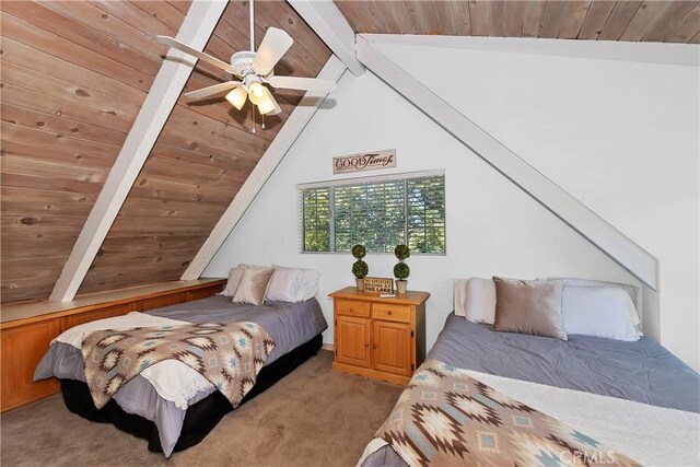 carpeted bedroom with ceiling fan, wooden ceiling, and vaulted ceiling with beams