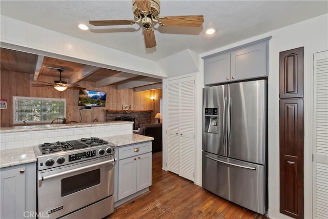 kitchen featuring dark wood-type flooring, appliances with stainless steel finishes, and gray cabinets