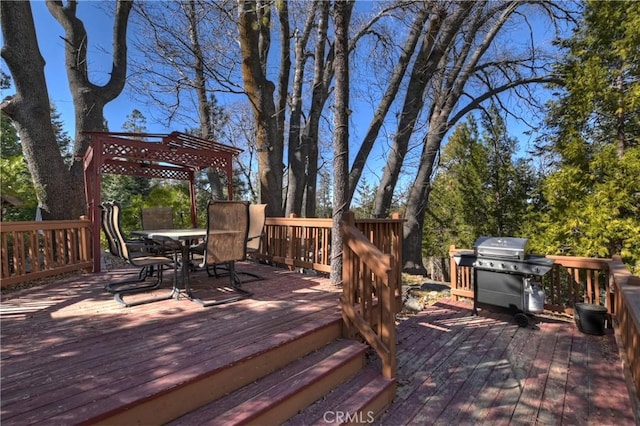 wooden terrace with a grill