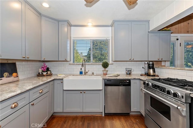 28621 Shenandoah Dr, Lake Arrowhead, CA 92352 - kitchen with stainless steel appliances, gray cabinets, decorative backsplash, and light stone countertops