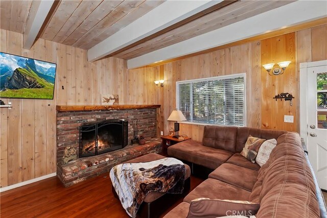 28621 Shenandoah Dr, Lake Arrowhead, CA 92352 - living room featuring wood walls, wood finished floors, a brick fireplace, and a wooden ceiling with exposed beams