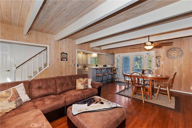 28621 Shenandoah Dr, Lake Arrowhead, CA 92352 - living room featuring wooden walls, wood finished floors, beamed ceiling, french doors, and stairs