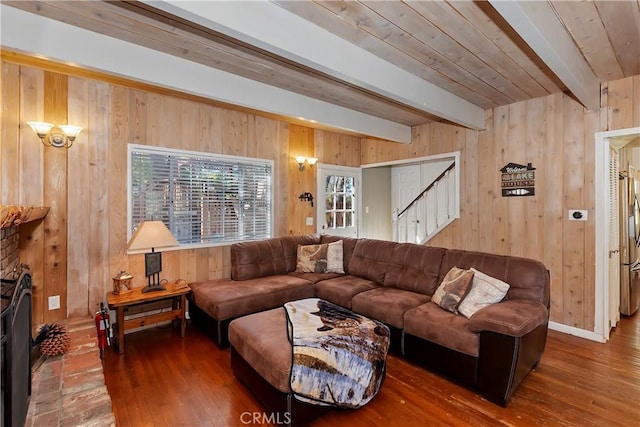 28621 Shenandoah Dr, Lake Arrowhead, CA 92352 - living room featuring beamed ceiling, wood walls, hardwood / wood-style floors, and stairs