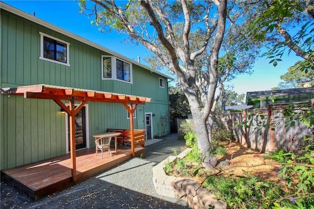 rear view of property with a deck