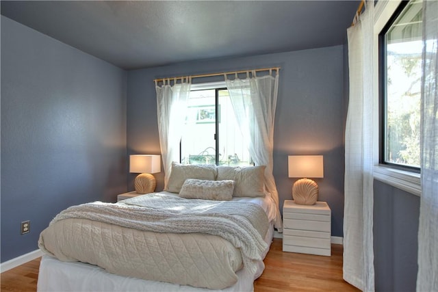 bedroom featuring light wood-type flooring