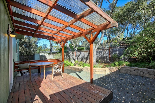 deck featuring a storage unit and a pergola