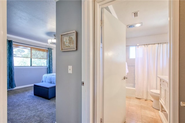 full bathroom featuring tile patterned floors, a healthy amount of sunlight, shower / bathtub combination with curtain, and vanity