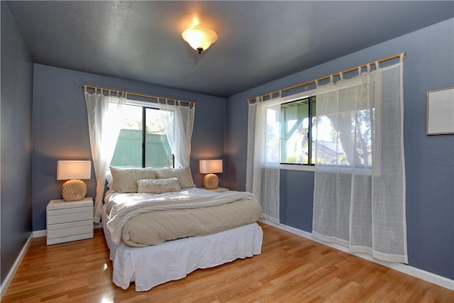 bedroom featuring hardwood / wood-style flooring