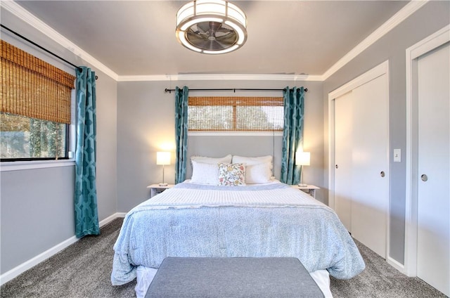 carpeted bedroom with ornamental molding and a closet