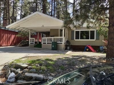 view of front of property featuring a carport and covered porch