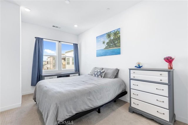 bedroom with baseboards, recessed lighting, visible vents, and light colored carpet