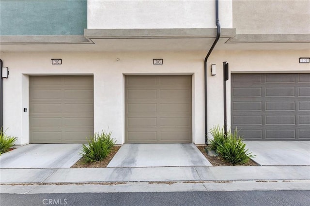 garage featuring driveway