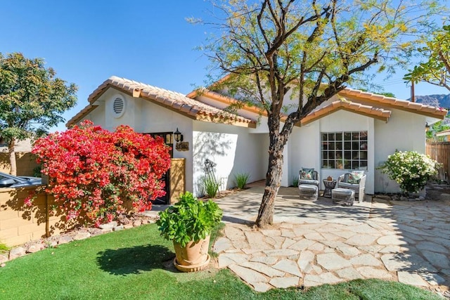 back of house with a patio