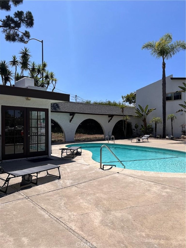 view of pool featuring a patio